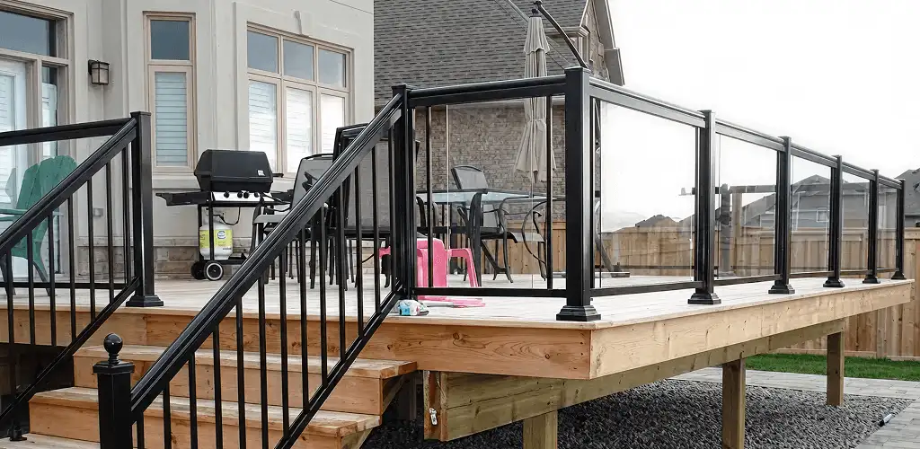 Handrail installation on a deck staircase for safety and code compliance in Staten Island, NY